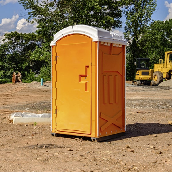 what is the cost difference between standard and deluxe portable toilet rentals in Delmont